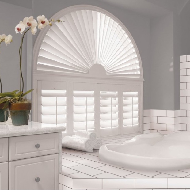 Arched shutters in a bathroom