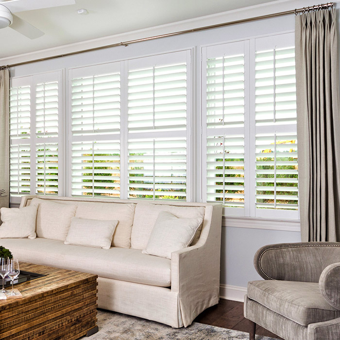 White painted shutters in a living room.