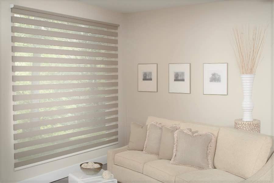 Zebra shades give you a unique combination of light control and style that benefits your Jacksonville home. Zebra shade allows filtered light into a living room