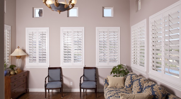 Chic parlor with interior shutters