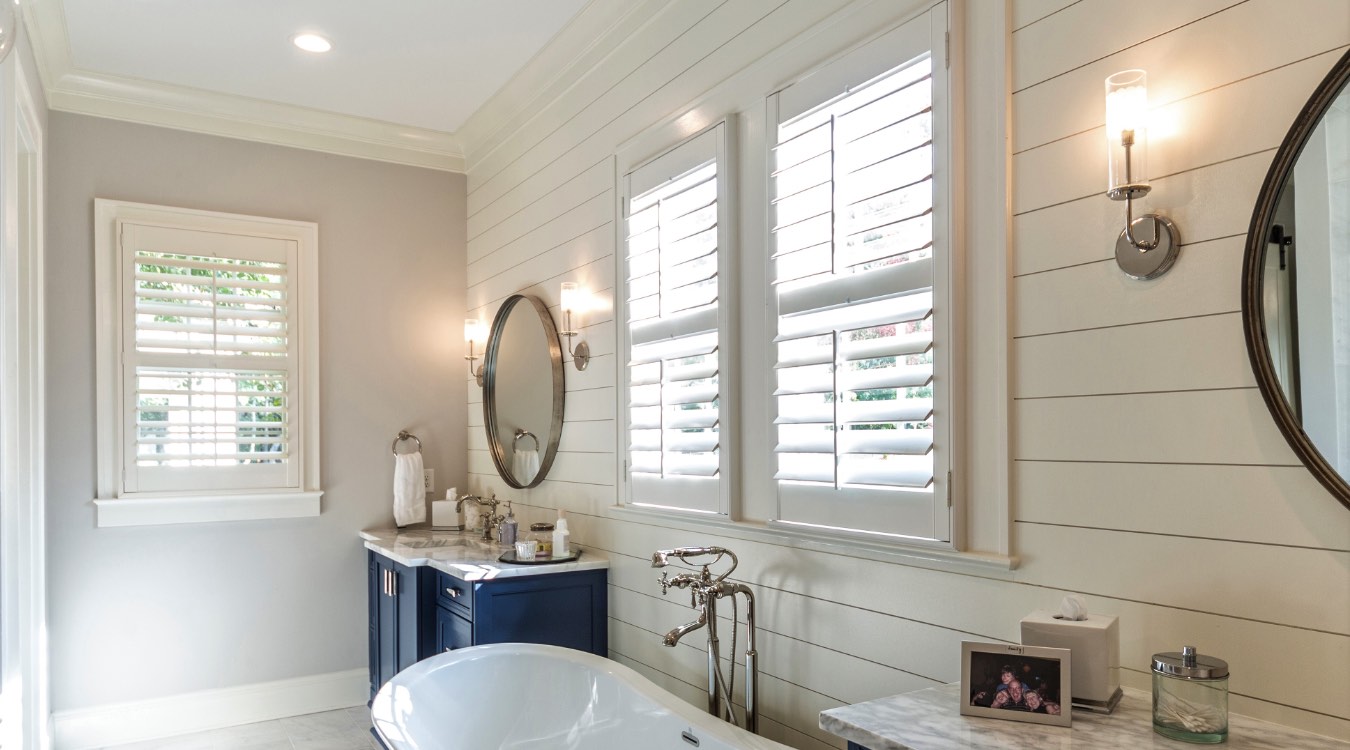 Jacksonville bathroom with white plantation shutters.