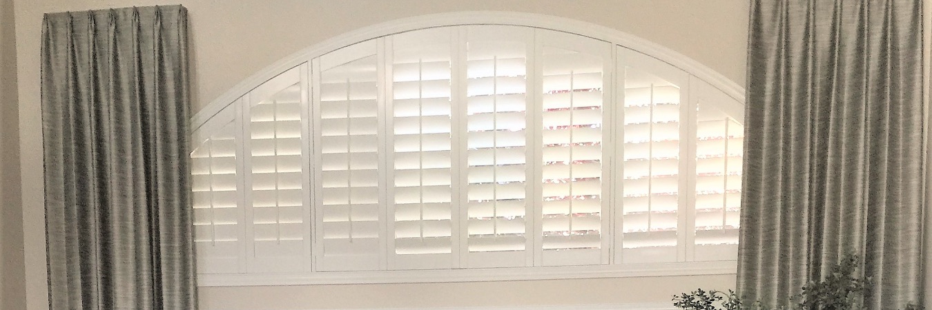 Arched window with shutters