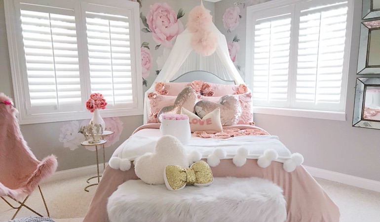 Plantation shutters can add some flair to your kid’s bedroom. Plantation shutters in a girls bedroom