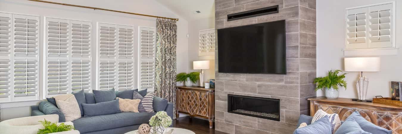 Plantation shutters in Middleburg family room with fireplace