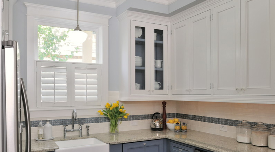 White cafe shutters in a kitchen.