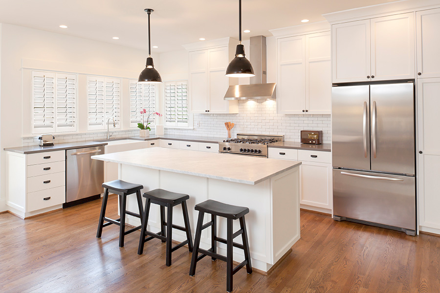 white kitchen with white polywood shutters