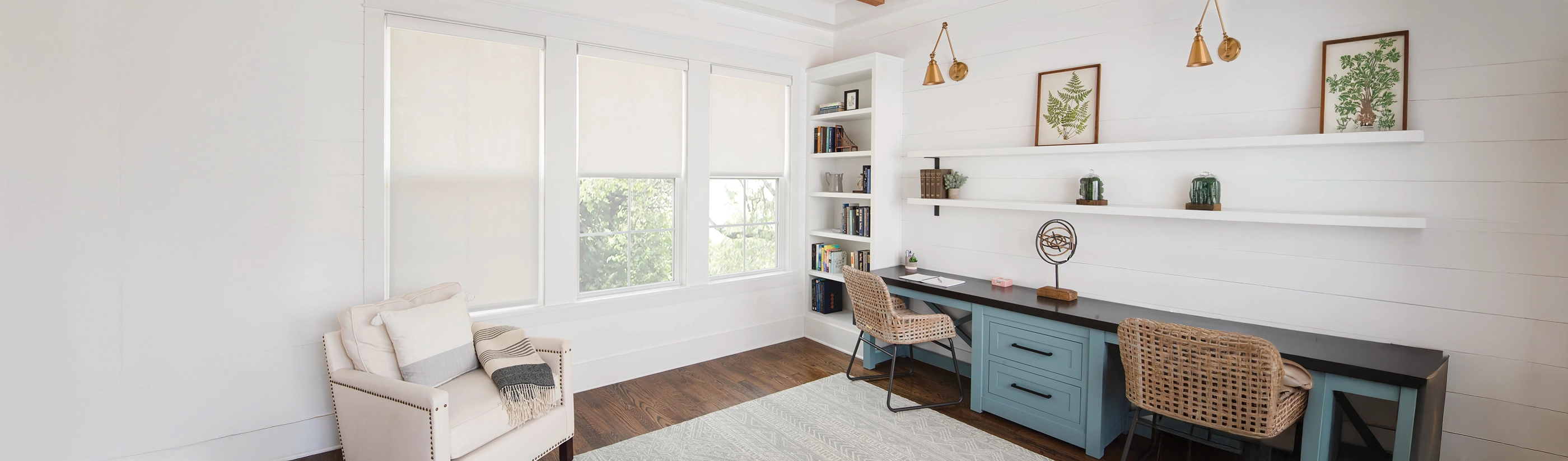 White roller shades in a modern living room.