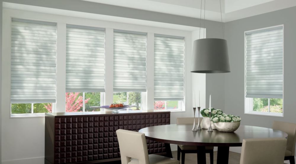 Custom cordless roller shades have a clean look and are appropriate for any room. Cordless motorized shades in a Jacksonville dining room