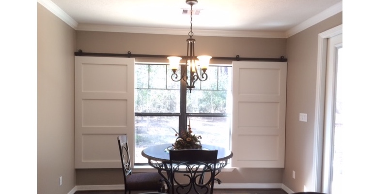 Barn doors open horizontally with slides instead of cords. Jacksonville barn door shutters