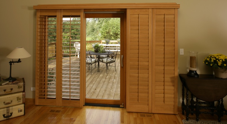 You can even match your wood shutters to your patio. Jacksonville wood shutter sliding door