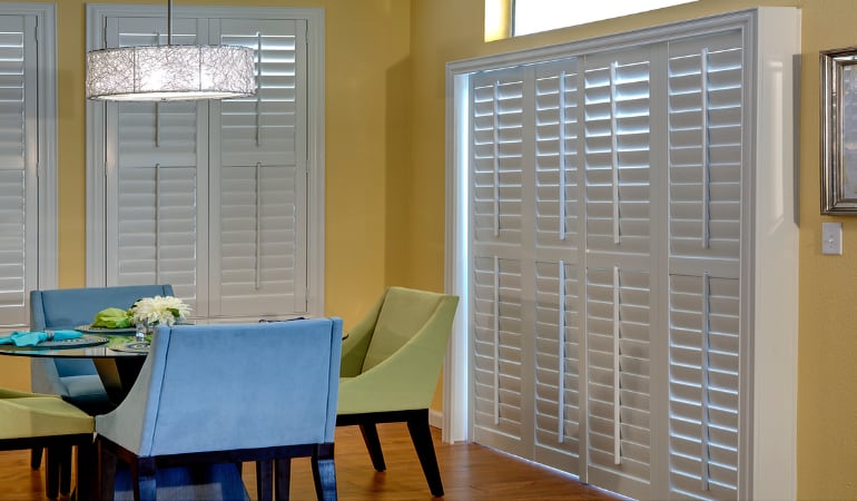 Plantation shutters on a French door function like common window shutters. Patio Doors with Plantation Shutters in Jacksonville