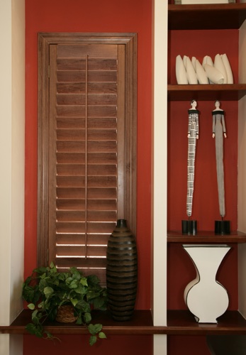You can even match your wood shutters with shelving. Jacksonville wood shutter shelving