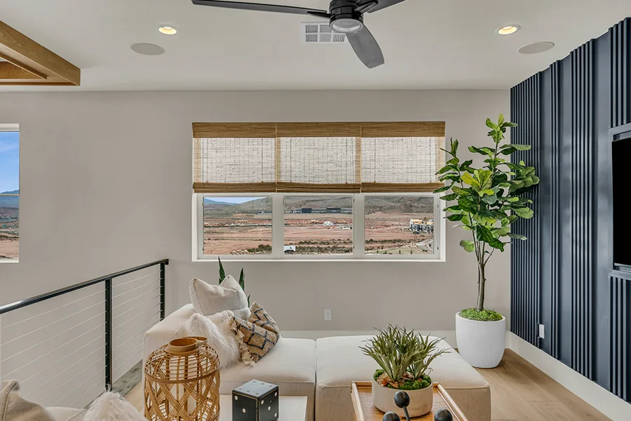Jacksonville homeowners who want eco-friendly home fixtures should consider natural woven shades. Natural brown woven shades on a window in a stylish sitting area