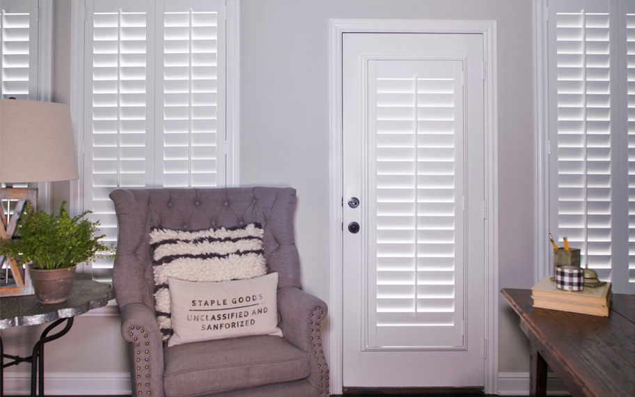Interior shutters are beautiful and durable window treatments for glass doors in Jacksonville. Polywood shutters on a door