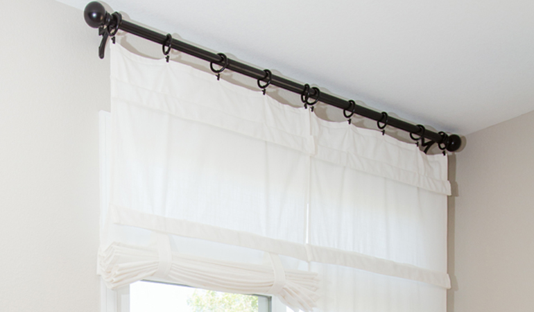 Tumble shades in Jacksonville give your doors privacy versatility and style. White tumble shade on double glass doors